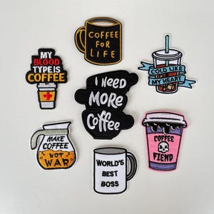 May include: A set of three ceramic mugs with a speckled, matte finish. The mugs are in shades of cream, light gray, and dark gray. Each mug has a simple, minimalist design, perfect for coffee or tea.