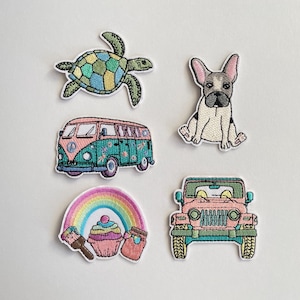 May include: A collection of embroidered patches including a turtle, a French bulldog, a vintage van, a rainbow with a cupcake, and a pink Jeep. These colourful patches are ideal for customising clothing or accessories.