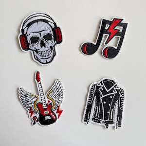 May include: Four embroidered patches with a rock and roll theme. Includes a skull wearing headphones, a musical note with a lightning bolt, a guitar with wings, and a black leather jacket.