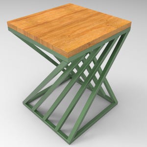 May include: A square side table with a wooden top and a green metal base. The tabletop is made of light brown wood planks. The base has a geometric design with angled, crisscrossing metal supports.