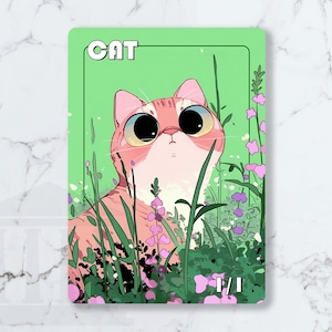May include: An illustrated card featuring a pink cat with large eyes, set amongst purple and pink flowers and green foliage. The word "CAT" is at the top, with "1/1" at the bottom. The background is a light green.
