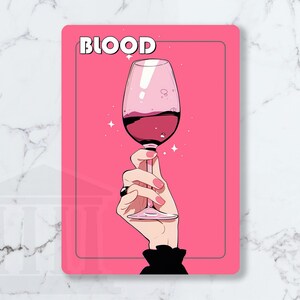 May include: A pink rectangular graphic with the word "BLOOD" in white block letters. The graphic features a hand holding a wine glass filled with red liquid. The background is pink with white star accents.
