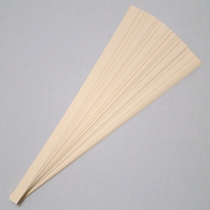 May include: A stack of thin, off-white paper strips, fanned out like a hand fan.