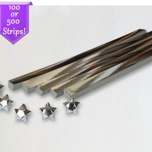 Puede incluir: Tiras de papel de origami plateadas, 100 o 500 tiras, con cinco estrellas de origami plateadas.