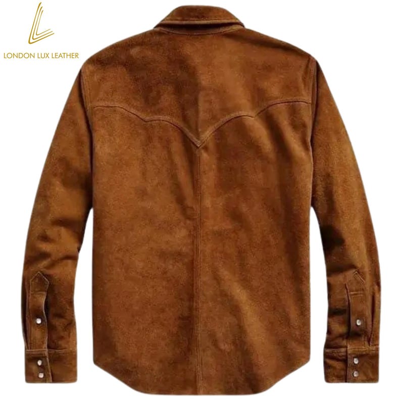 May include: A brown suede shirt with a classic Western yoke design on the back. The long-sleeved shirt has buttoned cuffs and a button-down front. The London Lux Leather logo is visible in the upper left corner.
