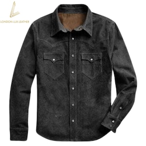 May include: A dark gray button-down shirt with two chest pockets and a collared neckline. The shirt has long sleeves with buttoned cuffs and a textured appearance. The brand "LONDON LUX LEATHER" is printed in gold on the upper left corner.