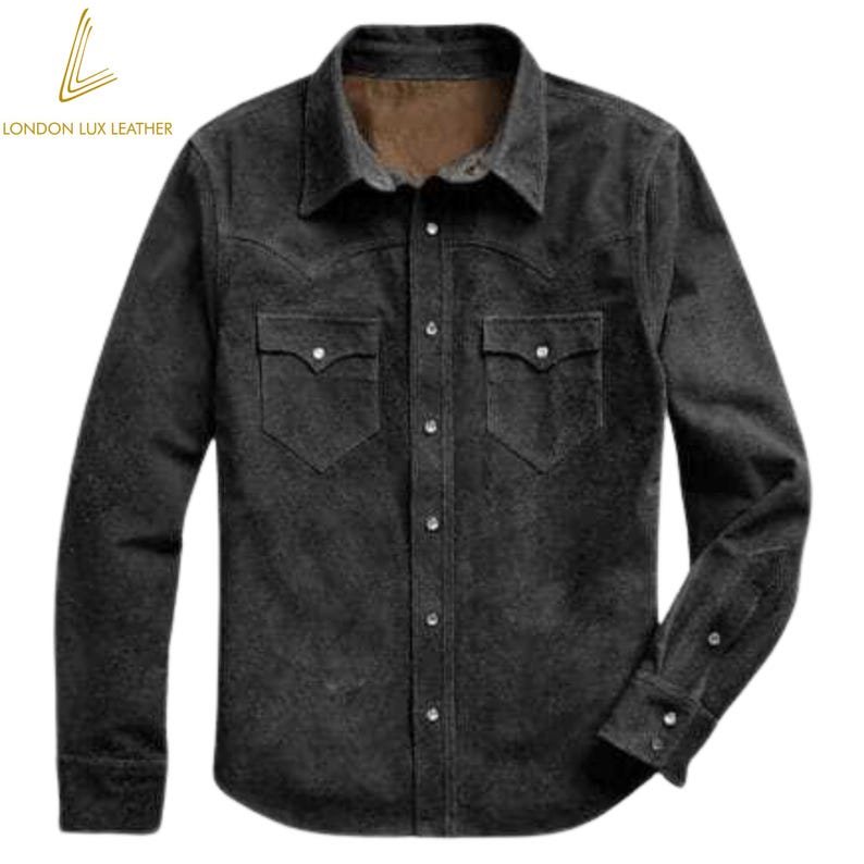 May include: A dark gray button-down shirt with two chest pockets and a collared neckline. The shirt has long sleeves with buttoned cuffs and a textured appearance. The brand "LONDON LUX LEATHER" is printed in gold on the upper left corner.