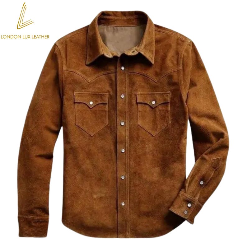 May include: A brown suede shirt with a button-down front, two chest pockets, and a classic collar. The shirt has long sleeves with buttoned cuffs. The London Lux Leather logo is in the upper left corner.