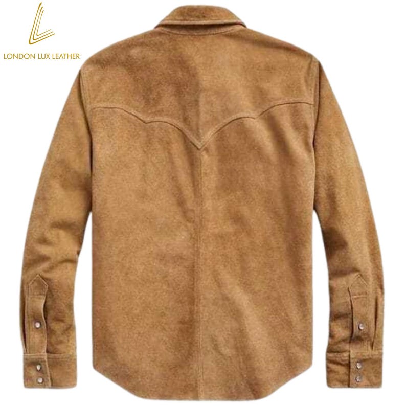 May include: A tan suede shirt with long sleeves, a button-down front, and a classic collar. The back features a decorative yoke design. The shirt has buttoned cuffs and is from London Lux Leather.