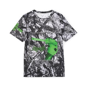 May include: Crew neck t-shirt with a camouflage design. The shirt features a green cobra graphic inside a chain border, with the word "Savage" in green. The text "Lips Have" is printed on the left sleeve.