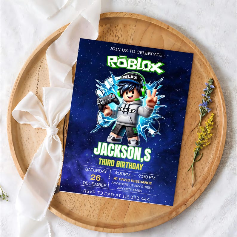 May include: A rectangular birthday invitation card featuring a dark blue space background with a Roblox character holding a game controller. The text reads JOIN US TO CELEBRATE ROBLOX, JACKSON,S THIRD BIRTHDAY, SATURDAY 26 DECEMBER, 4:00PM - 7:00PM.