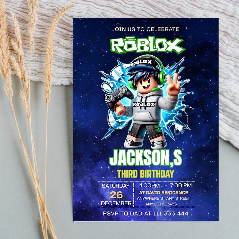 May include: A rectangular birthday invitation card with a dark blue space background featuring a Roblox character wearing a headset and holding a game controller. The text reads JOIN US TO CELEBRATE ROBLOX, JACKSON,S THIRD BIRTHDAY, 26 DECEMBER, 4:00PM-7:00PM.