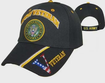 May include: A black baseball cap featuring the text U.S. ARMY on the back strap and ARMY VETERAN on the front. The front displays a United States Army emblem, while the brim includes a stylized V graphic with stars and stripes and the word VETERAN.