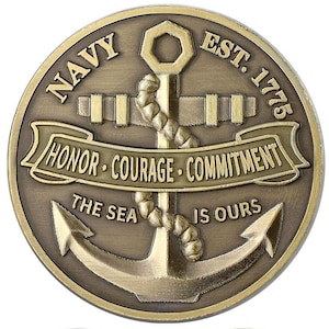 May include: A bronze-colored Navy coin featuring an anchor and the words "NAVY EST. 1775." The coin also includes the words "HONOR COURAGE COMMITMENT" and "THE SEA IS OURS" on a banner.