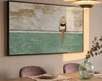 May include: A large framed painting depicts a figure in a straw hat reading a book, seated on a green surface. The artwork hangs above a wooden dining table set with plates, napkins, and purple chairs. A vase with greenery is on the table.