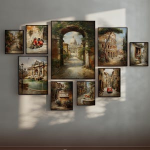 May include: A collection of framed art prints depicting Italian cityscapes. The artwork features scenes of architecture, streets, and landmarks, with a focus on warm colors and detailed brushstrokes. The prints are arranged on a neutral wall.