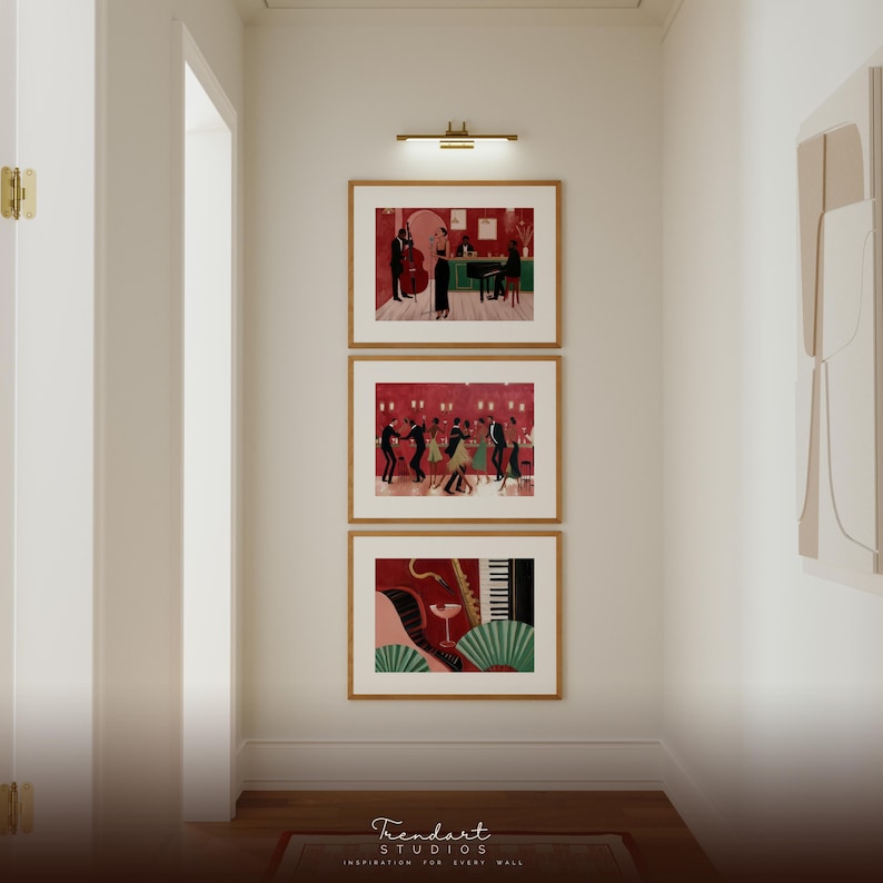 Gallery wall set in a hallway featuring three vertical frames including the jazz dance scene and saxophone players, creating a cohesive African American art collection.