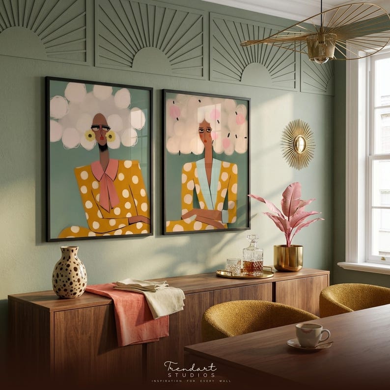 Boho wall art set — two quirky women with unimpressed expressions in gold ornate frames, warm mustard and teal tones, vintage styled room with patterned textile