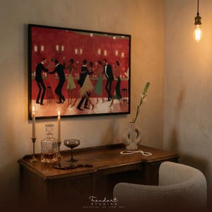 May include: A framed print shows a jazz club scene with dancing figures against a red backdrop. The artwork hangs above a wooden desk with a decanter, glass, candles, and a vase. A pearl necklace and a white chair are also visible.