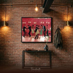 May include: A framed print shows a vibrant bar scene with people dancing, set against a red backdrop. The artwork hangs on a brick wall, above a black console table. A black vase with greenery and a leather jacket are also visible.