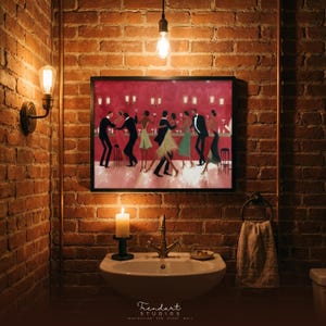 May include: A framed artwork of a jazz club scene with dancing figures hangs on a brick wall. A lit candle, a sink with a brass tap, and a towel ring are below the artwork. The image is illuminated by a light bulb.