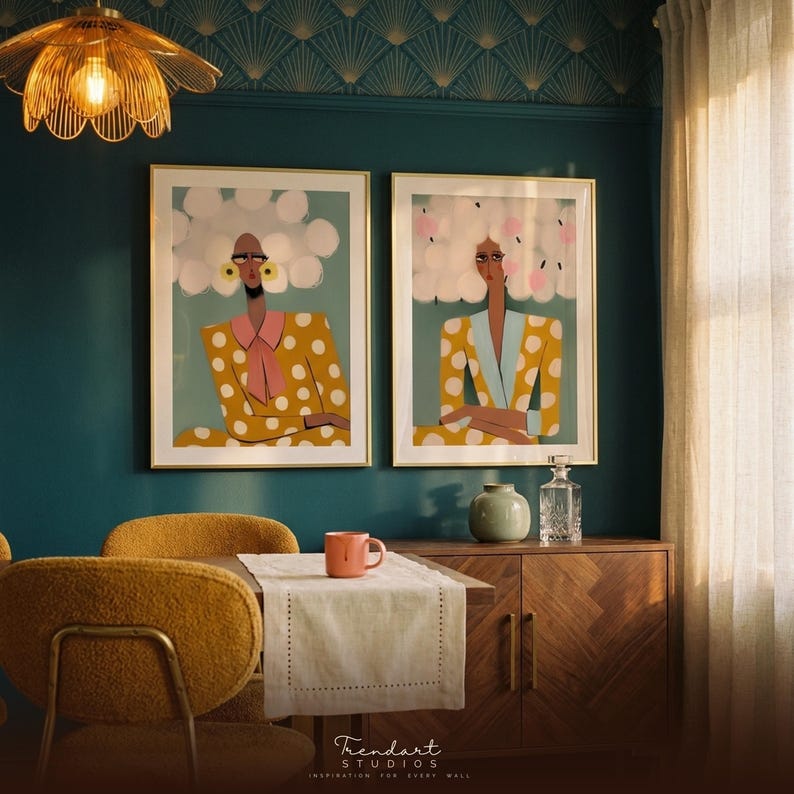 Quirky wall art — two women with gloriously unimpressed expressions in golden polka dot suits, framed print set displayed in modern eclectic interior room