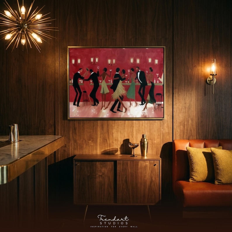 May include: A framed painting of people dancing in a bar with a red backdrop hangs on a wood-panelled wall. The scene is set with a mid-century modern cabinet, a leather sofa, and a gold cocktail shaker, creating a stylish interior.