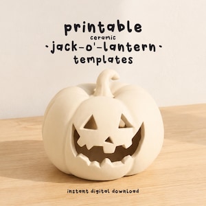 May include: A matte off-white ceramic jack-o'-lantern with a carved face featuring triangular eyes and a jagged mouth. The text above reads printable ceramic jack-o'-lantern templates and the text below reads instant digital download.