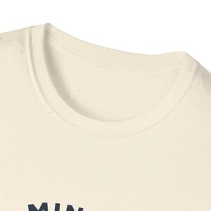 Vintage Minot Why Nots baseball logo shirt with shrugging mascot in navy and gray, Northern League North Dakota team.