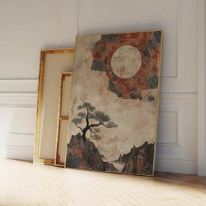 May include: A framed abstract art print with a large, white moon in the center, surrounded by a swirling, red and blue nebula. A small, black tree is silhouetted against the moon, and a mountain range is visible in the foreground.