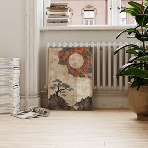 May include: A framed print of a stylized landscape with a large moon, a tree, and mountains. The print has a beige background with red, blue, and black accents.