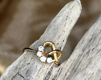 Vintage 14KT GE Knot Ring | Gold Electroplate Infinity Bypass, Four Clear Stones