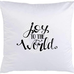 May include: White pillow with black text that reads "joy to the world" in a stylized font.