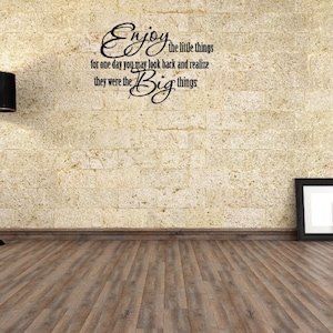 May include: A motivational quote on a beige brick wall: "Enjoy the little things for one day you may look back and realize they were the Big things."