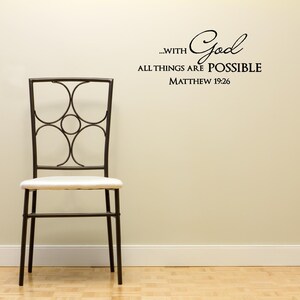 May include: A black metal chair with a white cushion sits in front of a beige wall with a black vinyl decal that reads "...with God all things are possible Matthew 19:26".