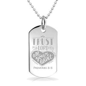 May include: Silver dog tag necklace with a heart and the inscription "Trust in the Lord with all your heart, Proverbs 3:5".