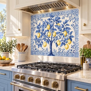 Right-angle view of the blue lemon tree glass backsplash behind a gas range in a sunlit Mediterranean-style kitchen.