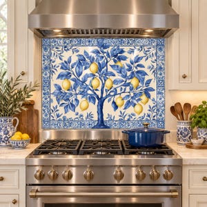 Blue and yellow botanical backsplash centered beneath a range hood in a luxury kitchen with walnut cabinets and brass details.