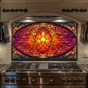 May include: A colorful, abstract kitchen backsplash featuring a vibrant floral design. The artwork showcases a central, flame-like shape in shades of yellow, orange, and red, surrounded by purple and green accents. The backsplash is framed in black.