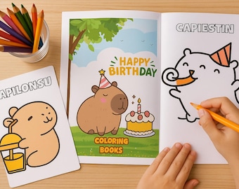 May include: A children's coloring book open to a page with the word "CAPIESTIN" and a cartoon character wearing a party hat. A hand holds an orange pencil, colouring the image. Beside it, a page with a capybara and the words "HAPPY BIRTHDAY".