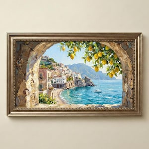 May include: A framed landscape painting depicting a coastal town with white buildings nestled on a cliffside overlooking a blue sea. A stone archway frames the scene, with bright yellow lemons hanging from green branches in the foreground.