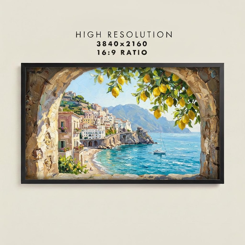 May include: A framed oil painting print depicting a coastal Mediterranean town viewed through a stone archway. Bright yellow lemons hang from a branch in the foreground. The scene includes multi-story buildings, a beach, and a boat on blue water.