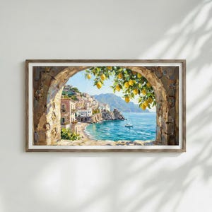 May include: A framed landscape painting depicting a coastal town with buildings nestled on cliffs overlooking a blue sea. A stone archway frames the view, with yellow lemon branches hanging in the foreground and a small white boat on the water.