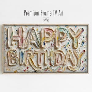 Puede incluir: Obra de arte rectangular con las palabras "HAPPY BIRTHDAY" en letras en relieve y texturizadas. Las letras están pintadas en una variedad de colores pastel, con un fondo blanco y un marco de madera. El texto "Premium Frame TV Art" está en la parte superior.