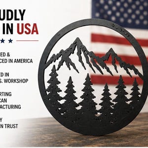 a black metal tree silhouette against a blurred American flag, with text highlighting that it is "Proudly Made in USA" and "Designed & Produced in America".
