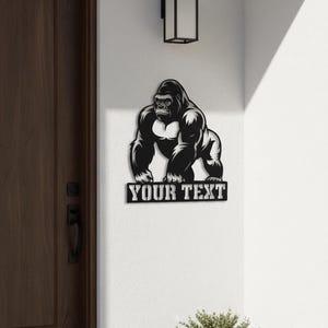 a wall art depicting a gorilla, with the text "YOUR TEXT" below it.