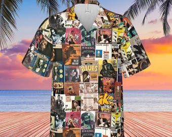 Peut inclure: Chemise à manches courtes avec un collage de pochettes d'albums vintage. Le motif comprend des images de musiciens de blues et des pochettes d'albums, avec une scène de plage tropicale en arrière-plan. La chemise a un col classique et une coupe décontractée.