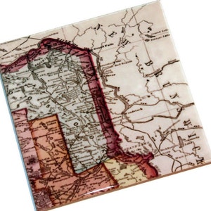 May include: An antique map of the United States, showing the states of Minnesota, Wisconsin, Iowa, Illinois, Michigan, and parts of New York and Pennsylvania. The map is printed on a white background with brown lines and text. The states are outlined in red and pink.