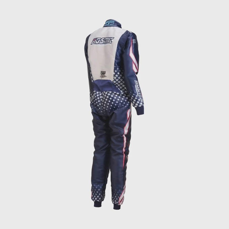 May include: A navy blue and white racing suit with a star pattern on the legs and sleeves. The suit has red and white stripes down the sides and the word "KOSMIC" on the back. The sleeves have the word "AMERICAN" printed on them.