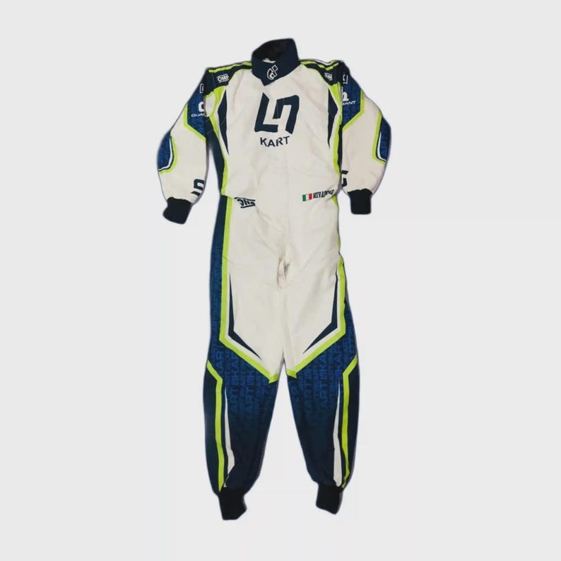 May include: White and navy blue racing suit with lime green accents. The suit features the text "L7 KART" on the chest and various sponsor logos. The suit has black cuffs and collar.